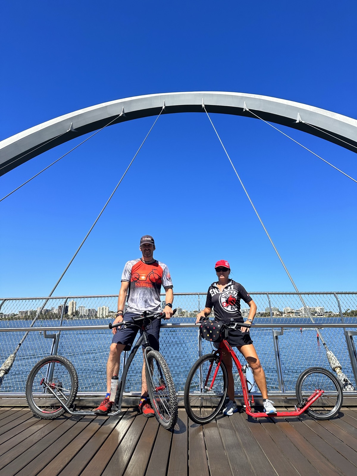 Regina and George with their footbikes on the Elizabeth Quay bridge